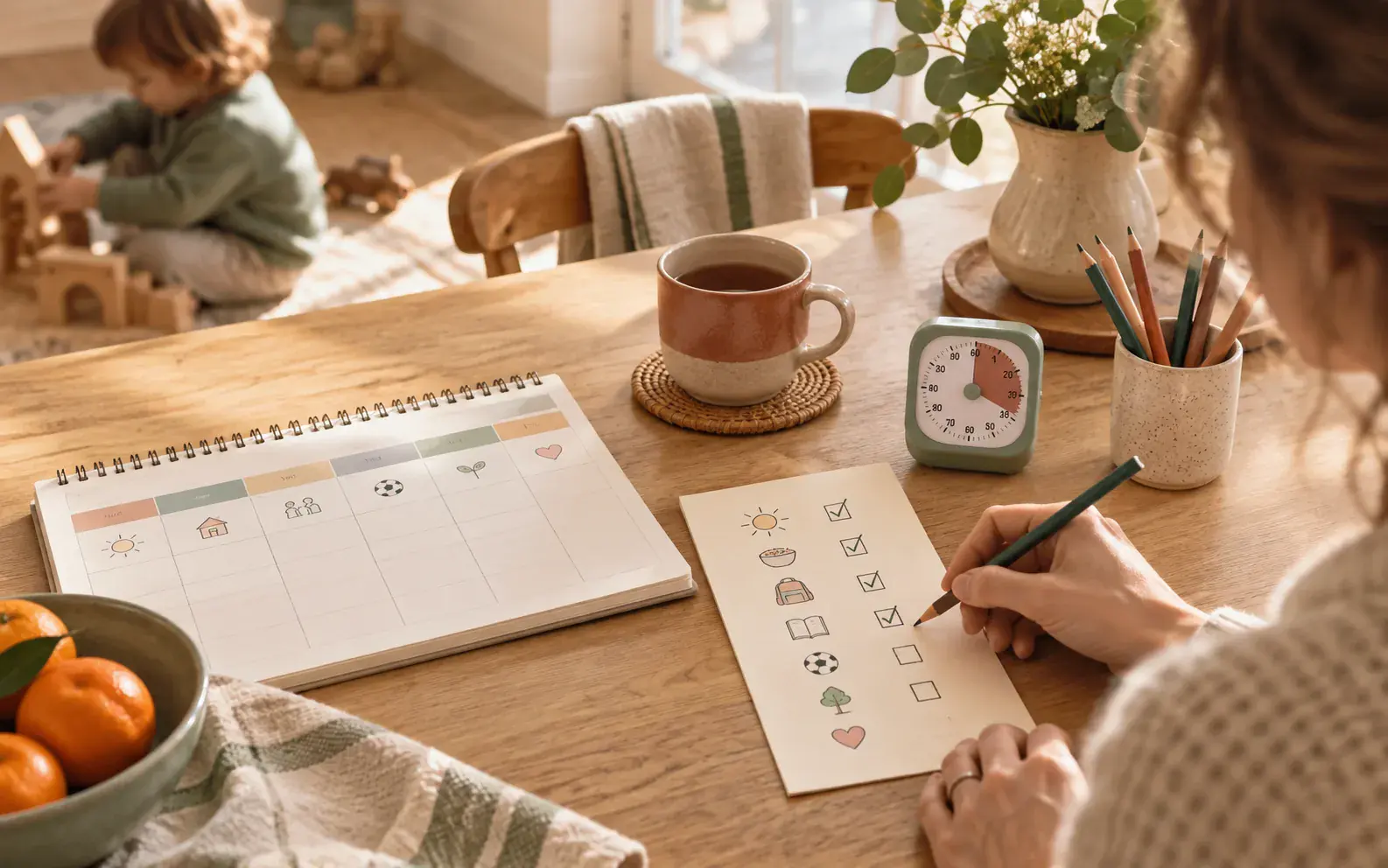 Family planners and practical parenting tools arranged on a kitchen table